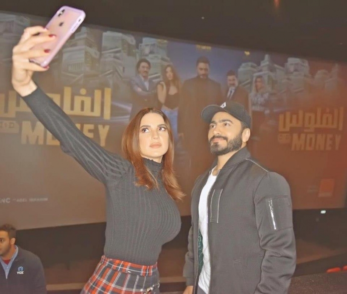 بالصور.. تامر حسني يحضر فيلم "الفلوس" بصحبة جمهوره